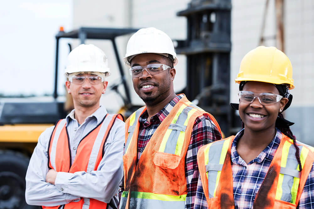 cmdseries2 3 construction workers standing next to one another with hardhats on