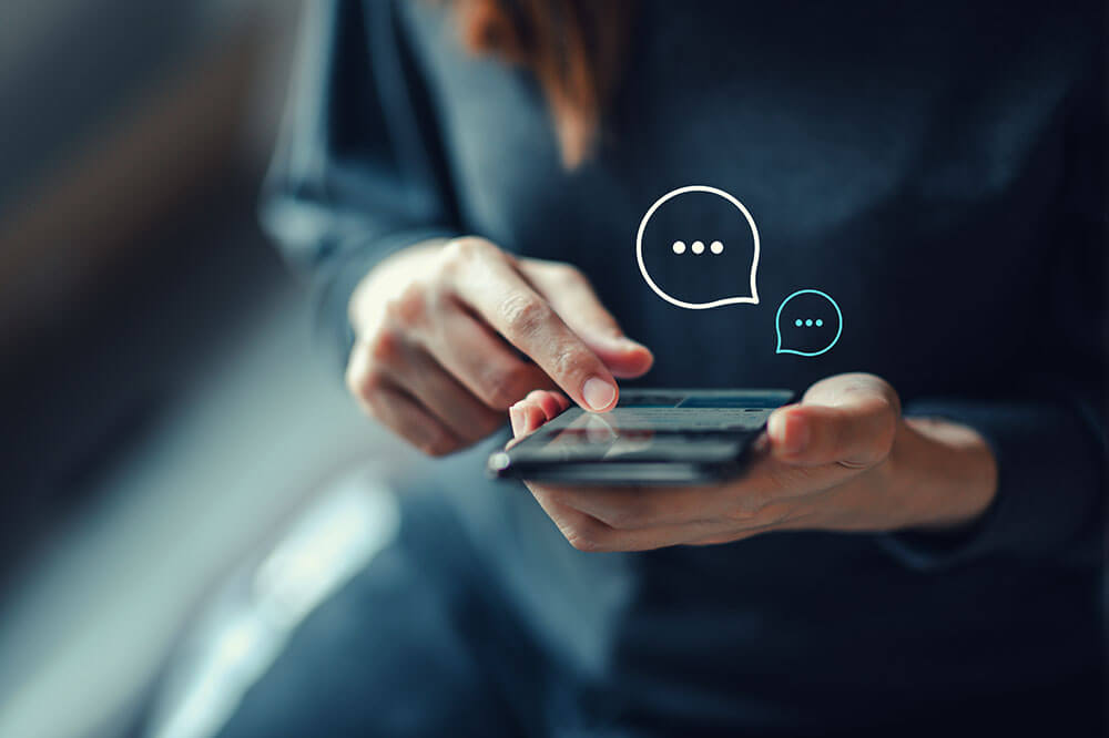 early_adpot_1 person on phone getting messages<br />