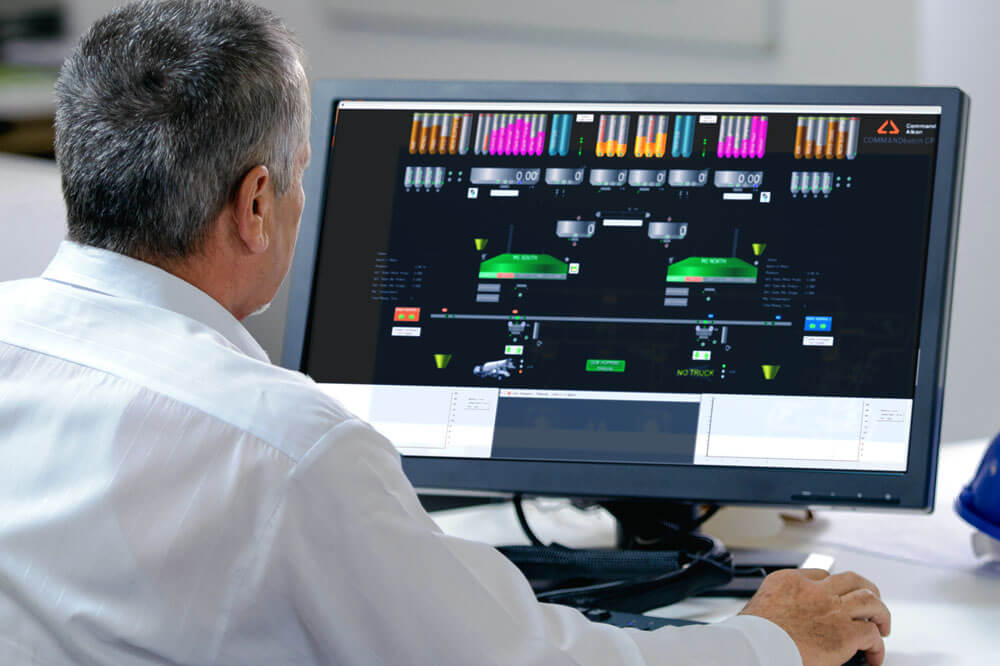 CP_Image_1 man sitting at desktop computer using COMMANDbatch cp